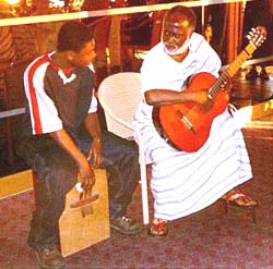 Koo Nimo on guitar with his son Yaw Amponsah on rhumba box, 2000.