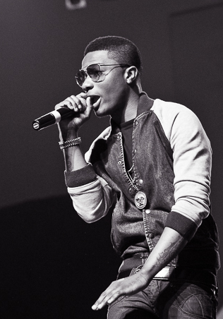 Wizkid performing at Iyanya's album-launch concert, 2013.